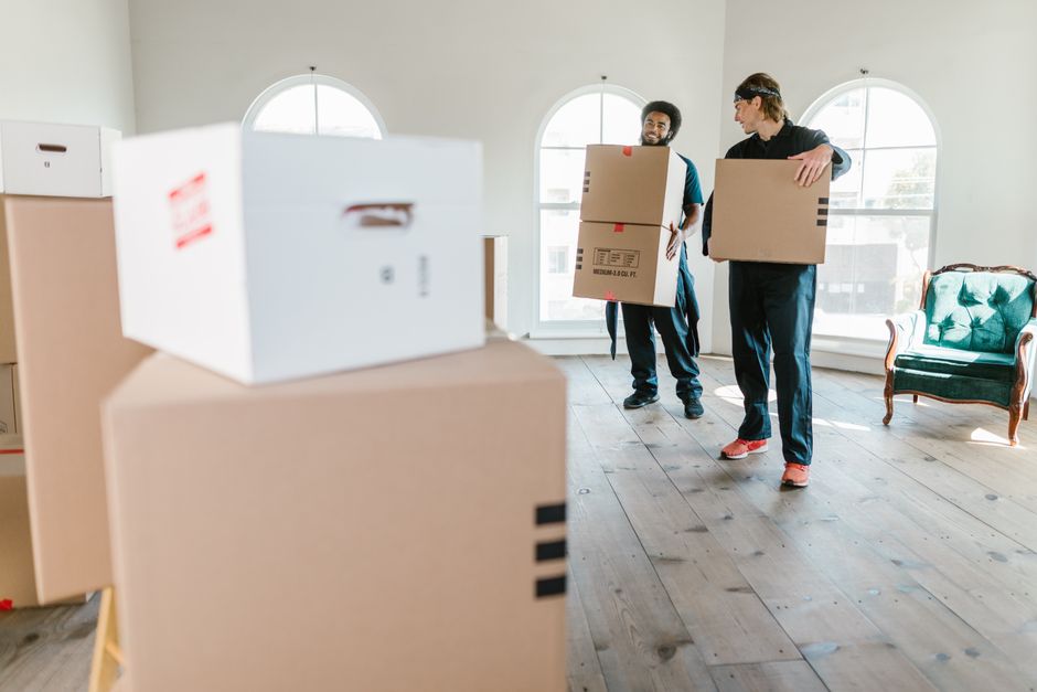 Professional moving team coordinating a residential move